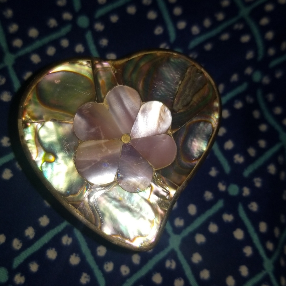 Metal heart shaped abalone box with clasp.